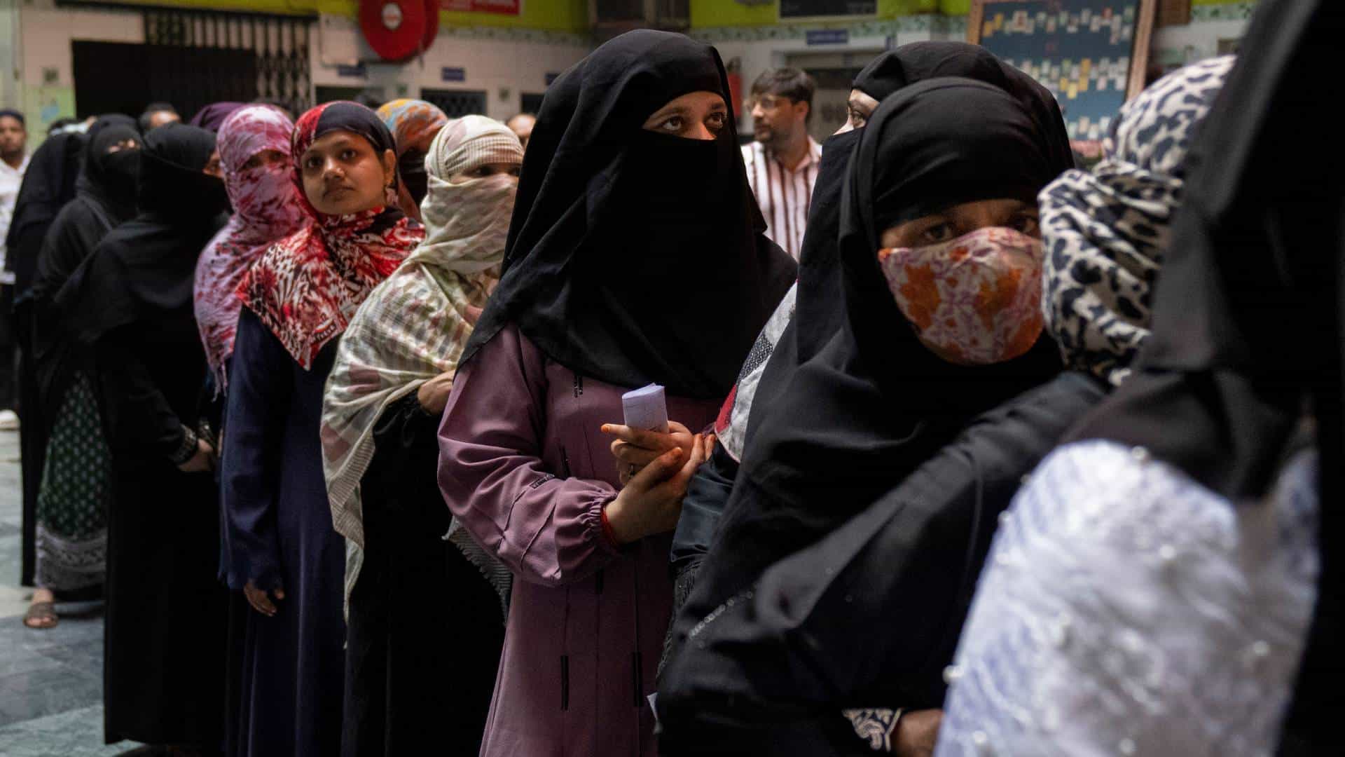 A Palestinian protester argues with Israeli security forces to prevent shooting tear gas at Palestinian protesters during a demonstration against Israeli settlements in the West Bank.
