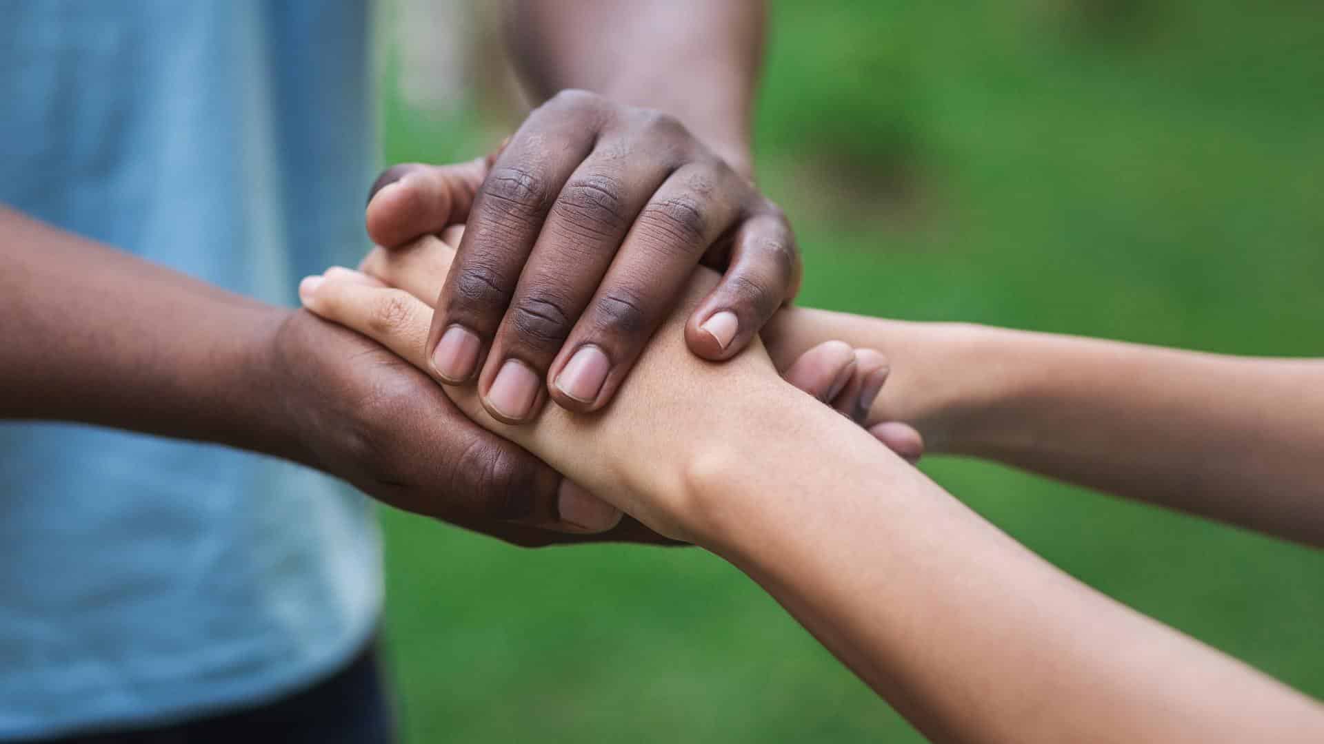 Hands grasped in empathy.