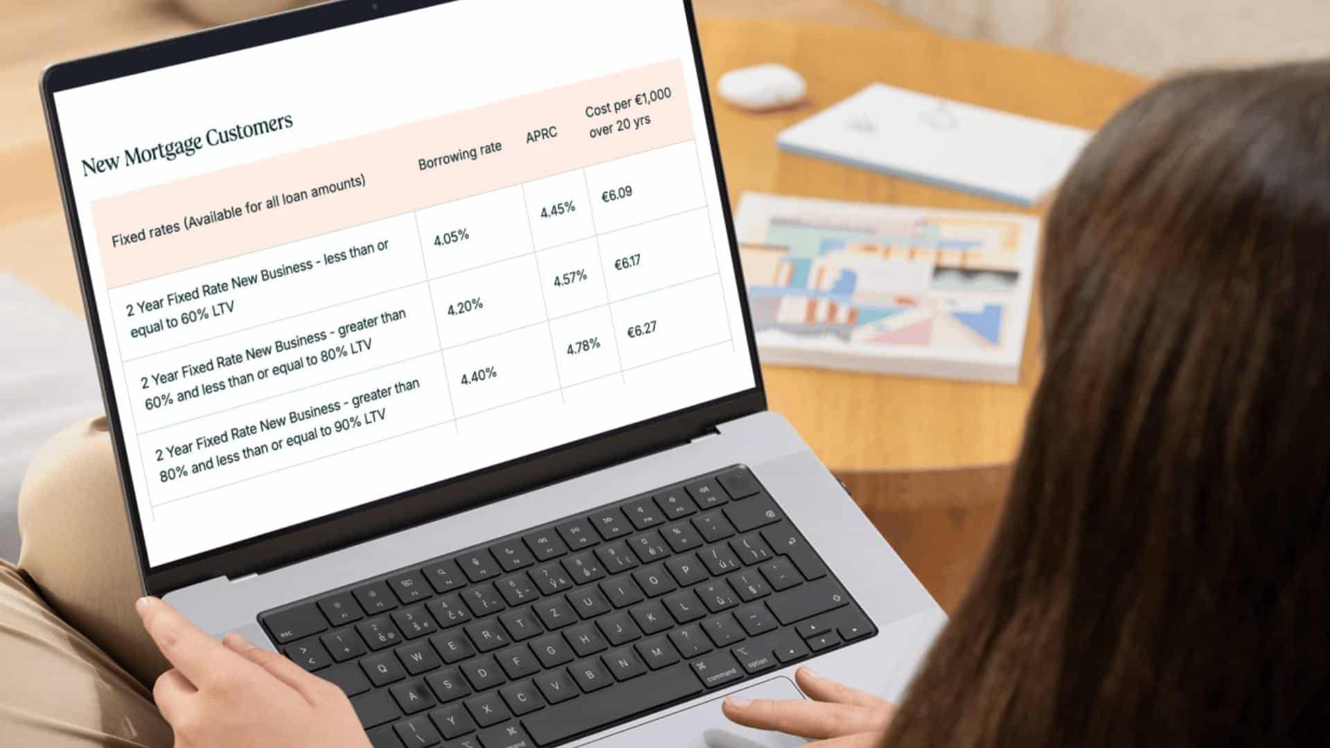 A woman tries to make sense of mortgage rates. 
