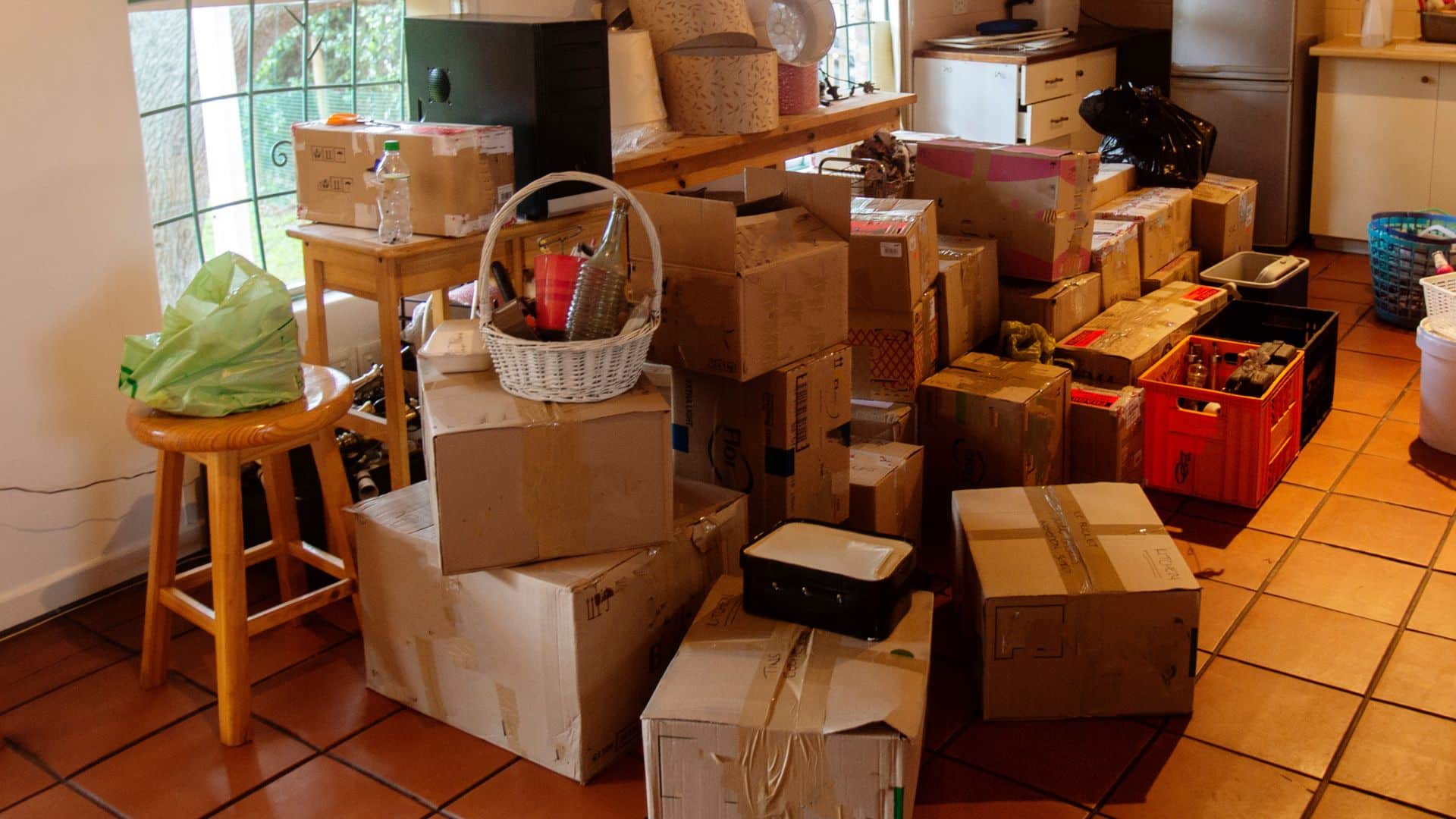 Unopened moving boxes crowd a new home.