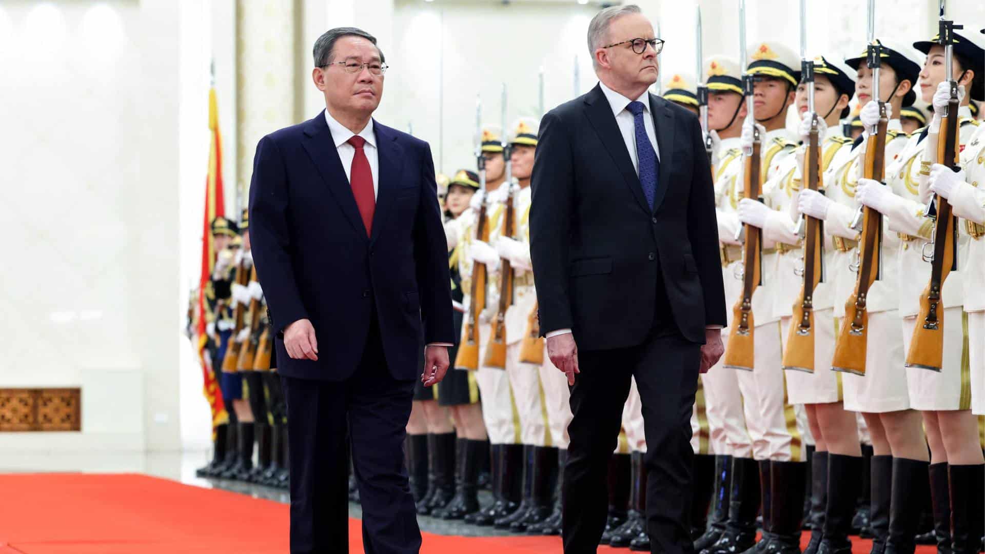 Australia caught between powers Australian Prime Minister Anthony Albanese, right, walks with Chinese Premier Li Qiang during a ceremonial welcome at the Great Hall of the People in Beijing.
