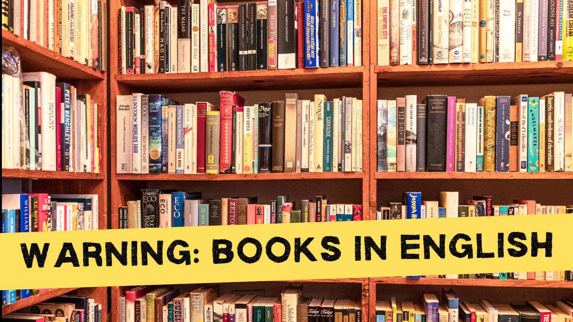 Bookstore shelves with yellow warning tape that the books are in English.