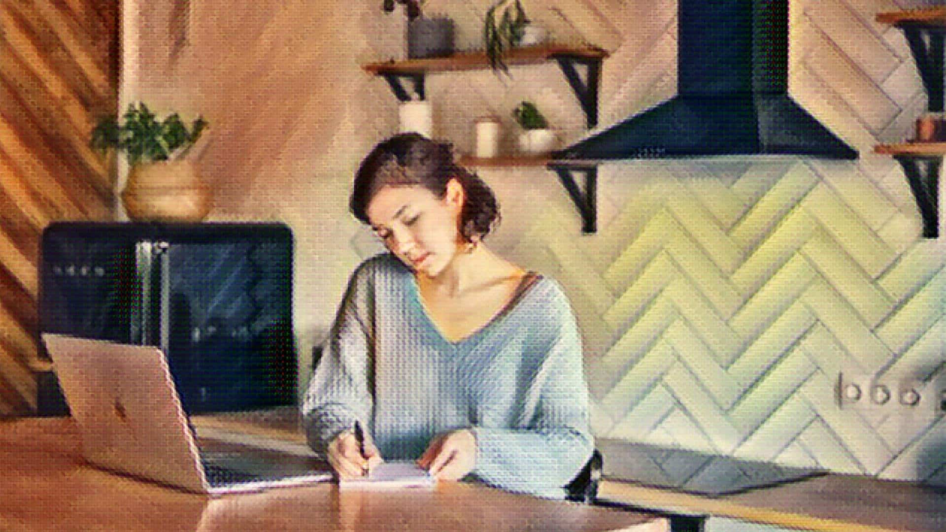 A woman freelances from her kitchen.
