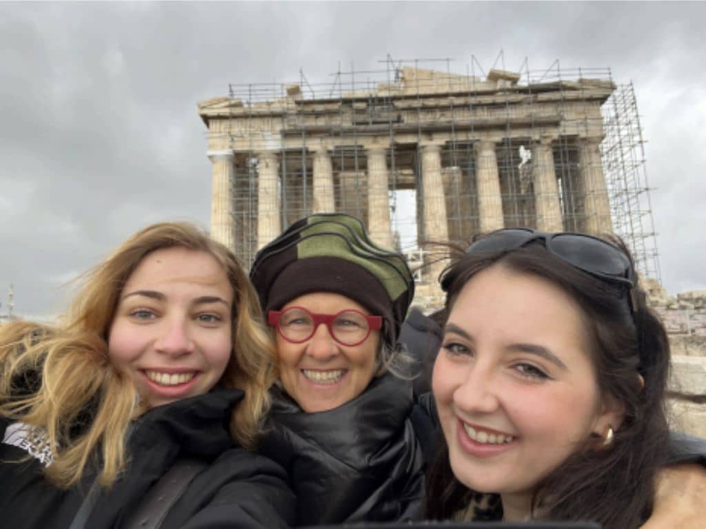 <br />
Annabel Prunty (right), Professor Theodoratou (middle), and I (left) pose in front of the Parthenon, which on this day sat below looming clouds.<br />
