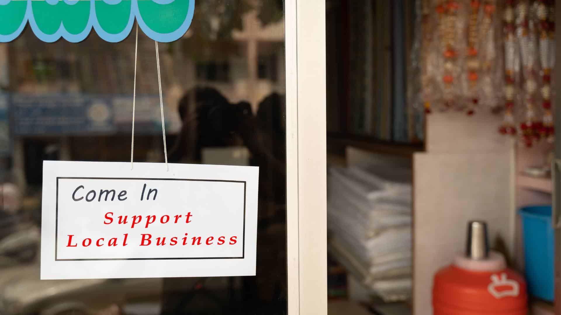 Local busness A sign in a small business says Support Local Business