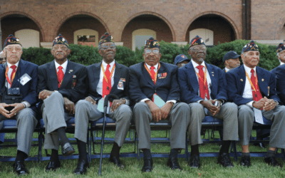 Montfort Point veterans pose with Lt. Gen. Robert F. Hedelund, commanding general, II Marine Expeditionary Force, during the Montford Point Marine Memorial gifting ceremony at the Montford Point Marine Memorial in Jacksonville, N.C., July 25, 2018.