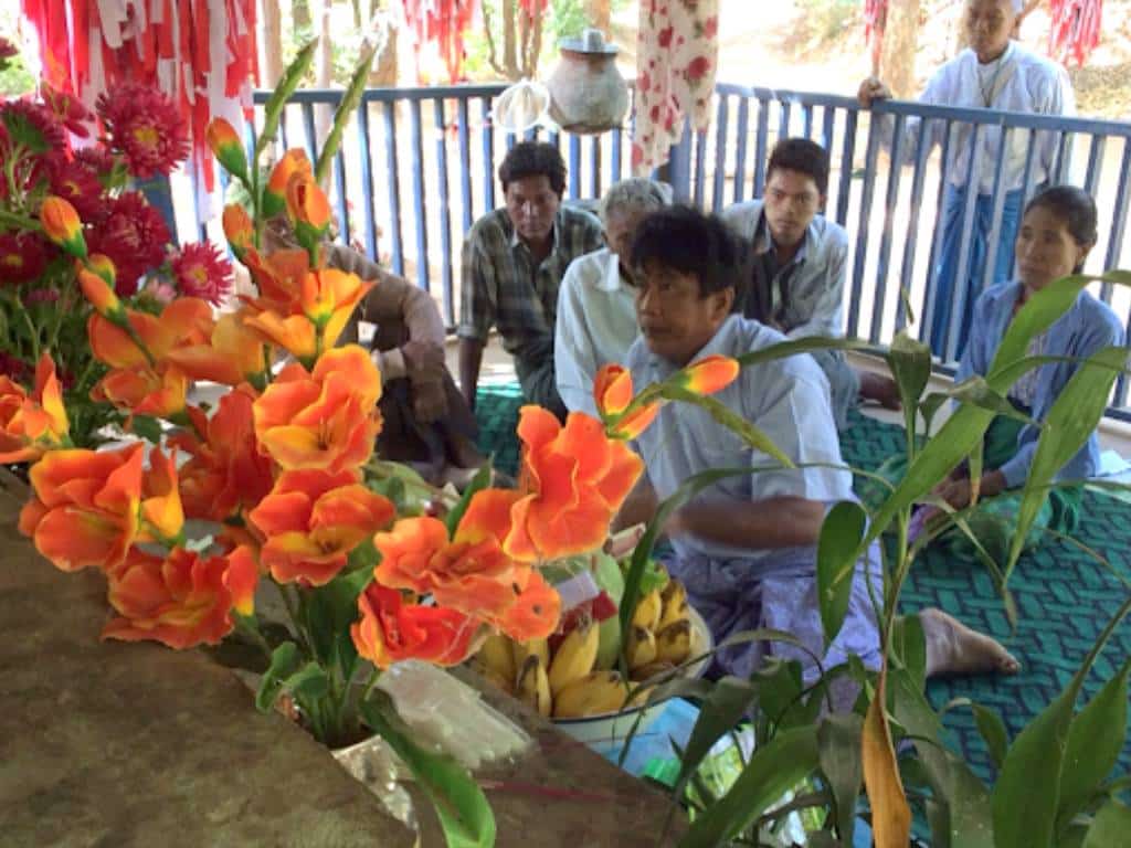 U Maung Nyo, 46, a nat kadaw (a medium who speaks with nats) prepares for a séance with the forest nats.
