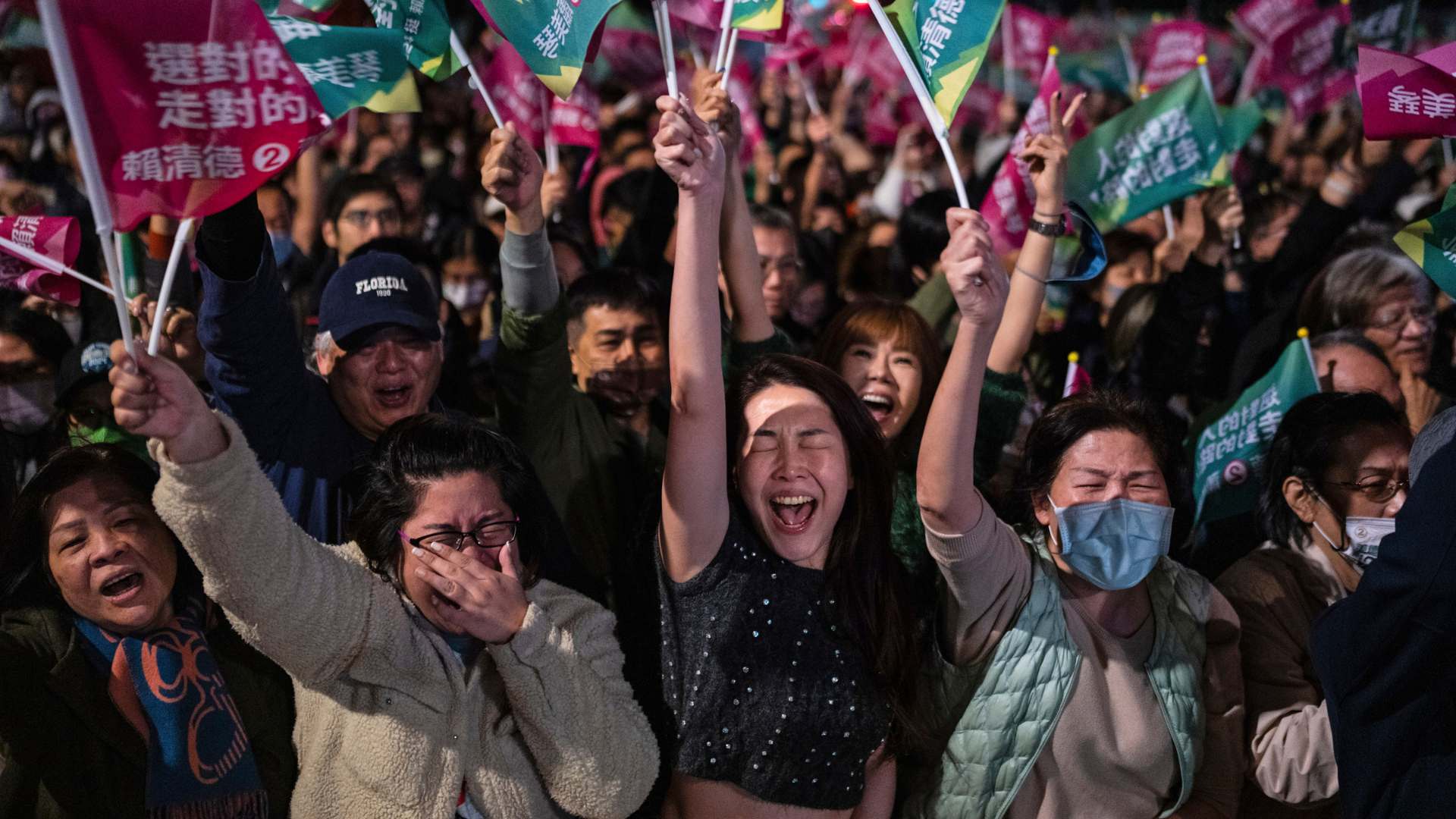 The crowd cheers at a Democratic Progressive Party rally in Taipei, Taiwan,