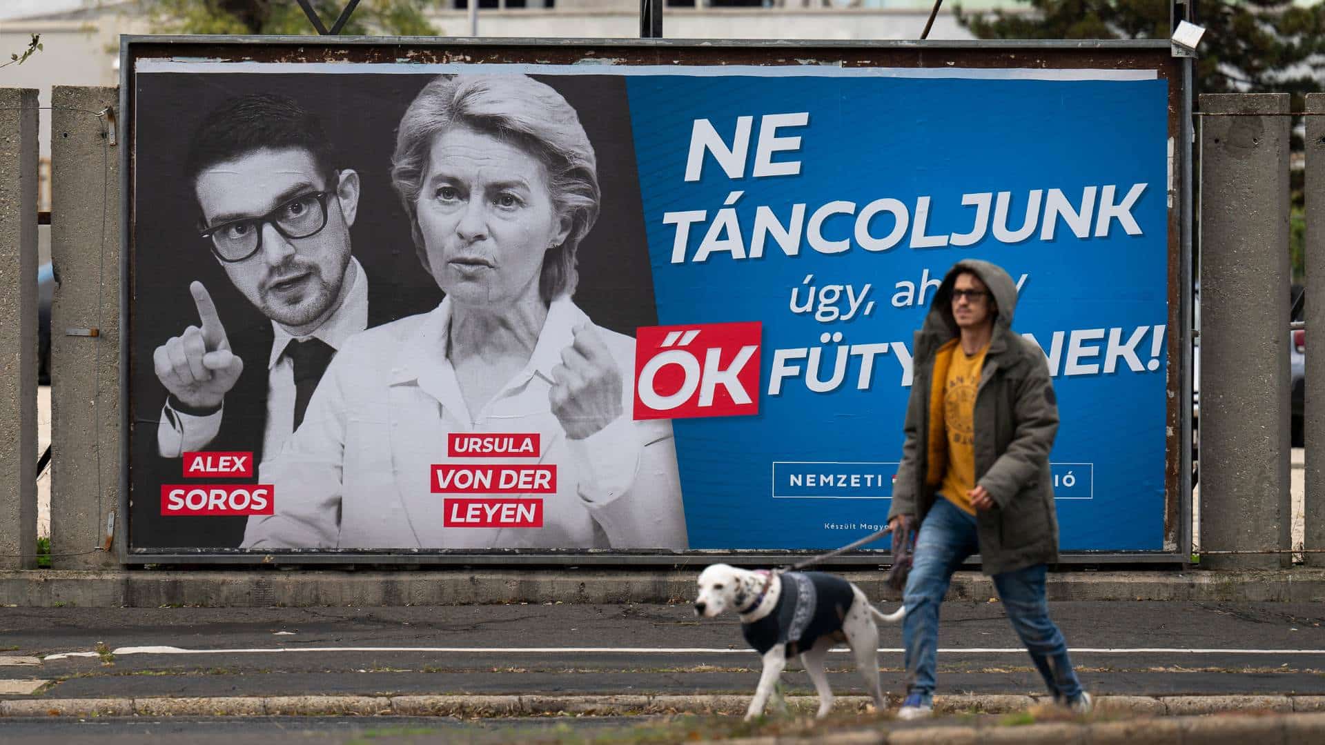 A government billboard reading "Let's not dance to their tune" is seen with portraits of Alex Soros and Ursula von der Leyen in downtown Budapest, Hungary,