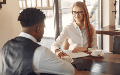 Man Being Interviewed By A Woman.