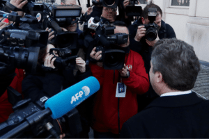 Wire services A microphone from a reporter from Agence France Press