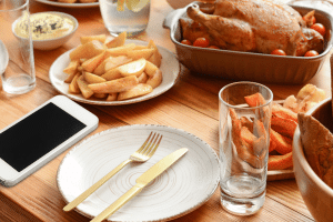 Technology divide A smart phone sits on a dinner table.